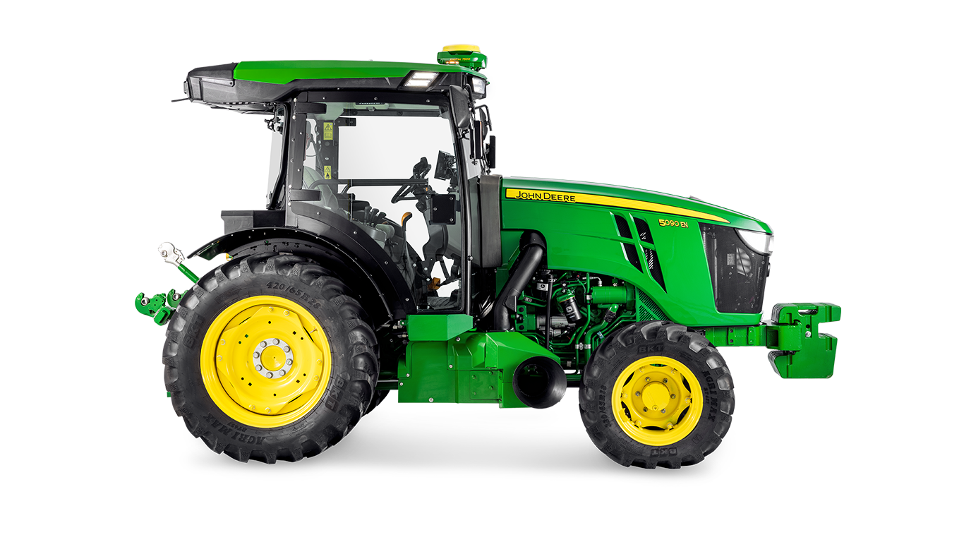 Страничен профил на трактора John Deere 5090EN, който акцентира върху конструкцията на кабината и големите задни гуми.